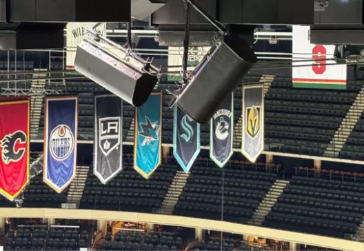 Team banners hanging in a sports arena