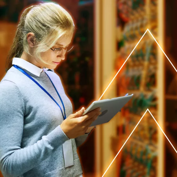 A woman using a tablet.