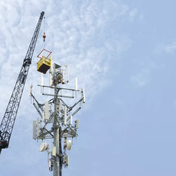 A crane next to a tower