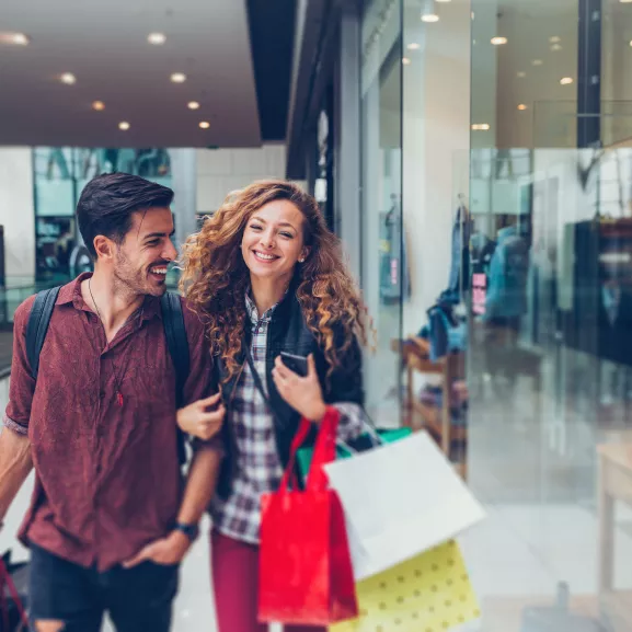 Happy couple in the shopping center.